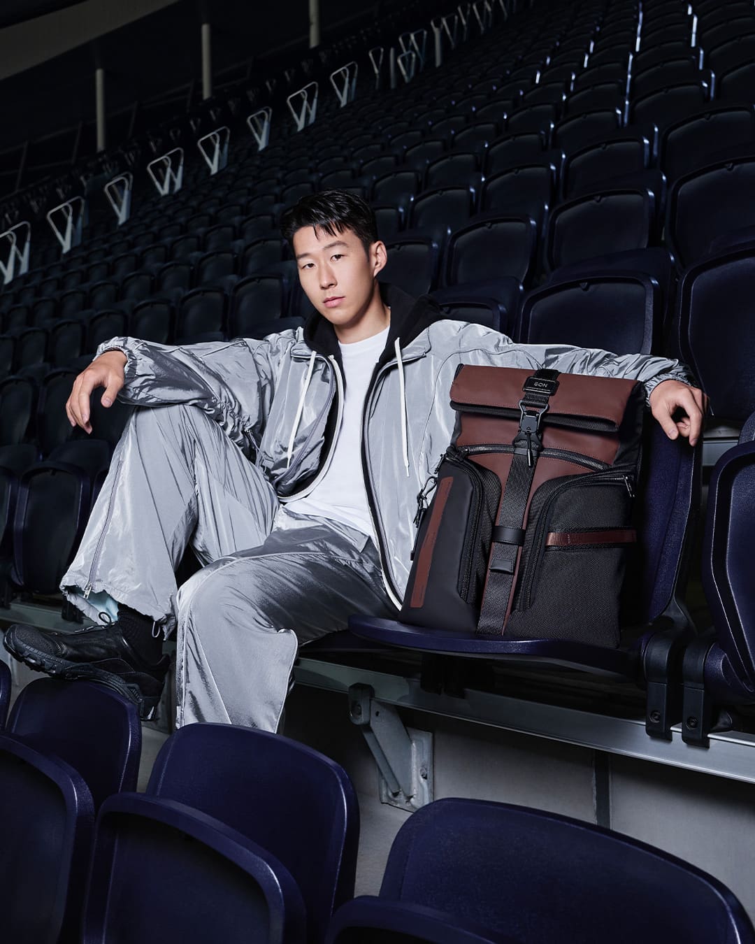 Song Heung Min posing with his TUMI bag