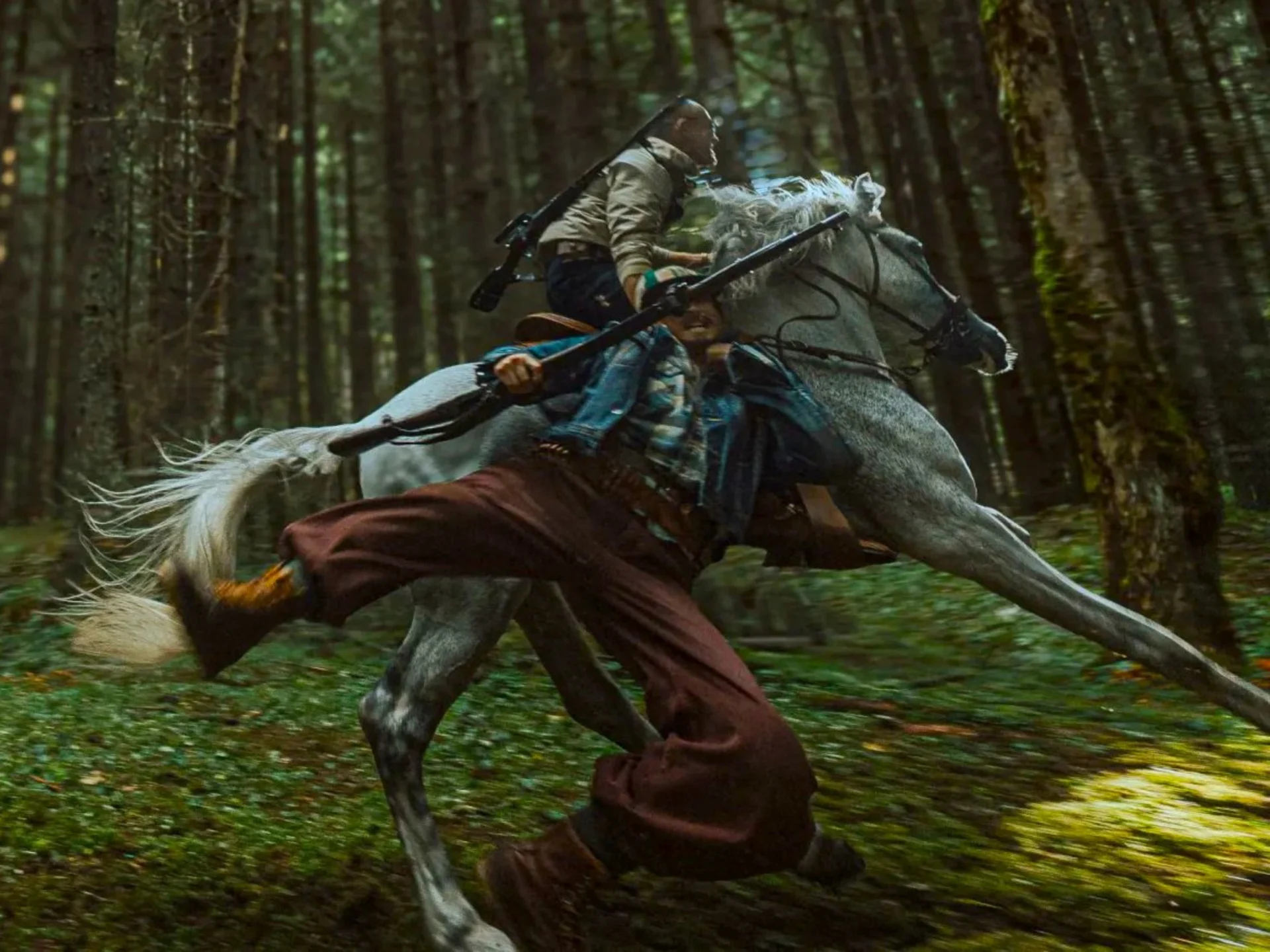 Warrior on a gray horse sprinting through a dense forest, with a bow strapped to his back and a cloak trailing.]"