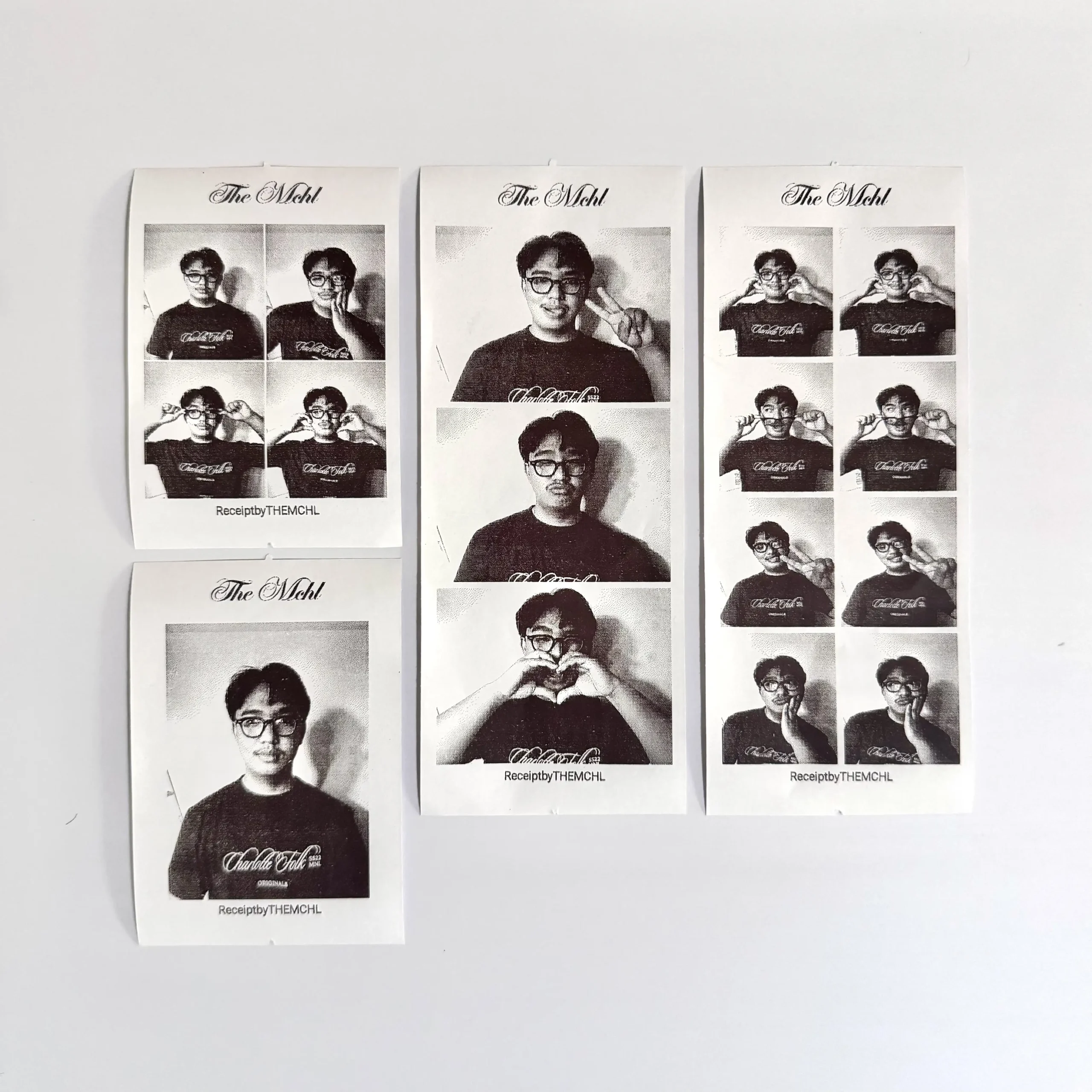 Three sheets of black-and-white portrait prints of a man with glasses posing, mounted on a white wall in a row.