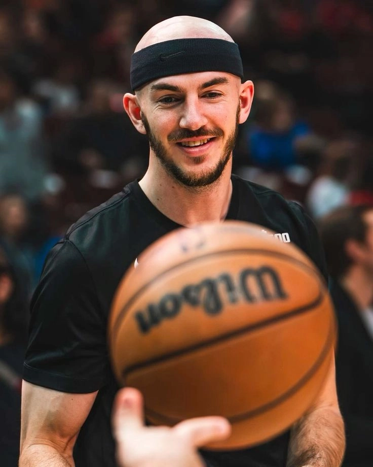 Bald basketball player wearing a headband 