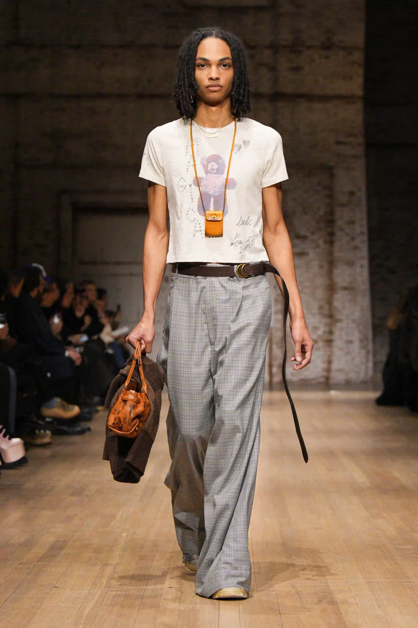 man wearing baby tee