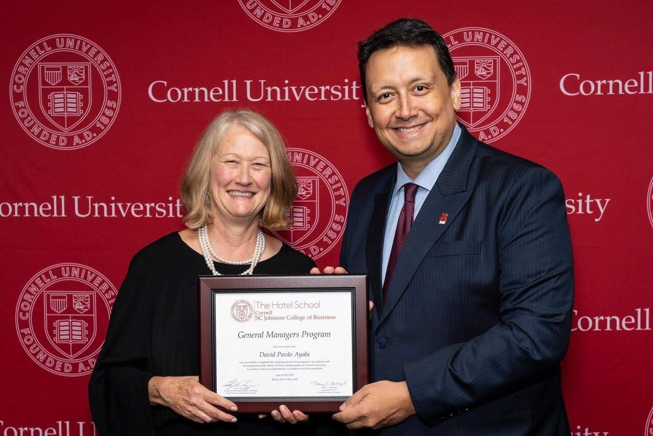Receiving his certificate upon completing Cornell Universitys General Managers Program